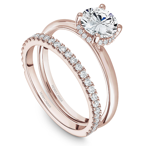 Rose gold ring with round diamond accents.