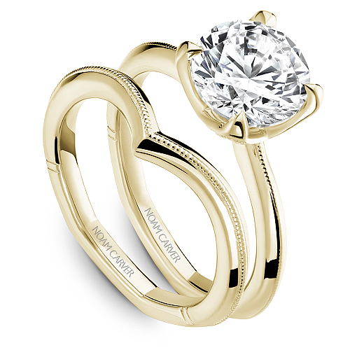 Yellow gold ring with round diamond accents.