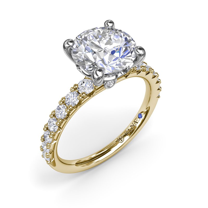 White-yellow gold ring with round diamonds.