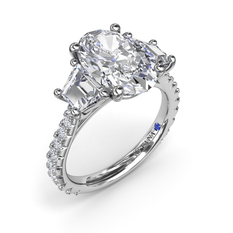 Three-stone diamond ring in white gold.