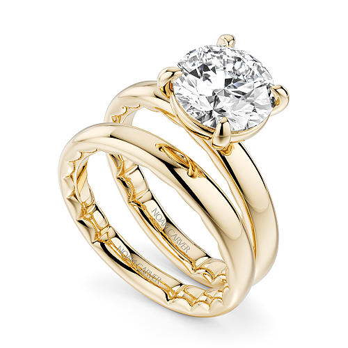 14K yellow gold solitaire diamond ring.