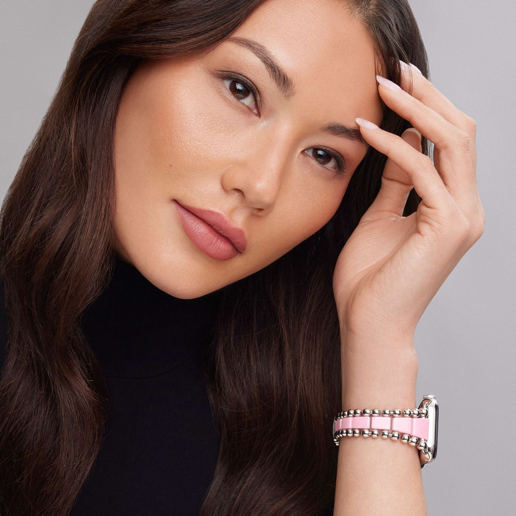 Pink ceramic and stainless steel watch bracelet.