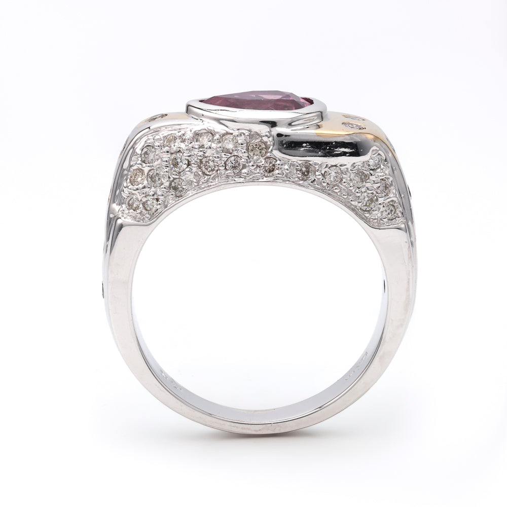 Pear pink sapphire ring with diamond accents.