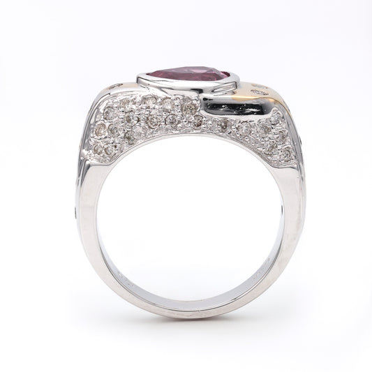 Pear pink sapphire ring with diamond accents.