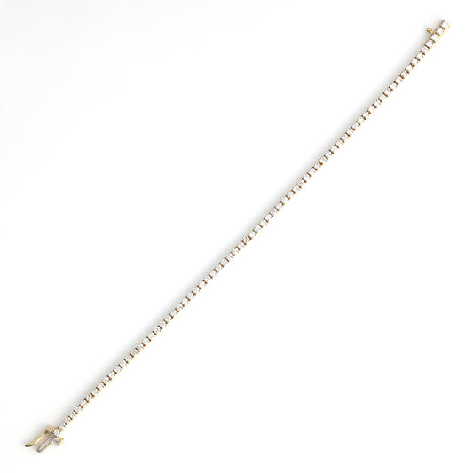 14K yellow gold diamond tennis bracelet.