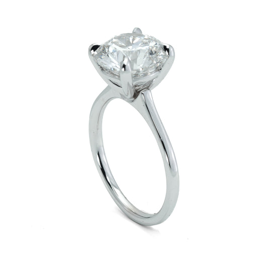 Solitaire lab-grown diamond engagement ring.