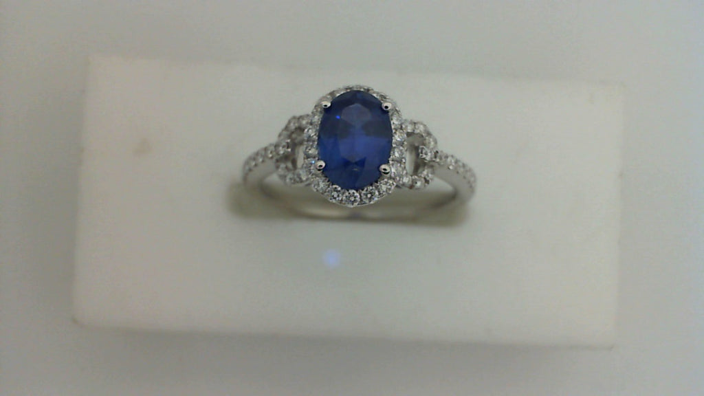 Oval sapphire ring with diamond accents.
