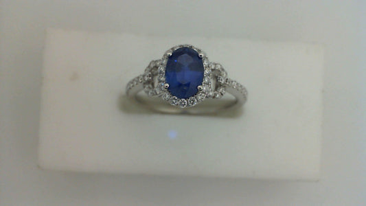 Oval sapphire ring with diamond accents.