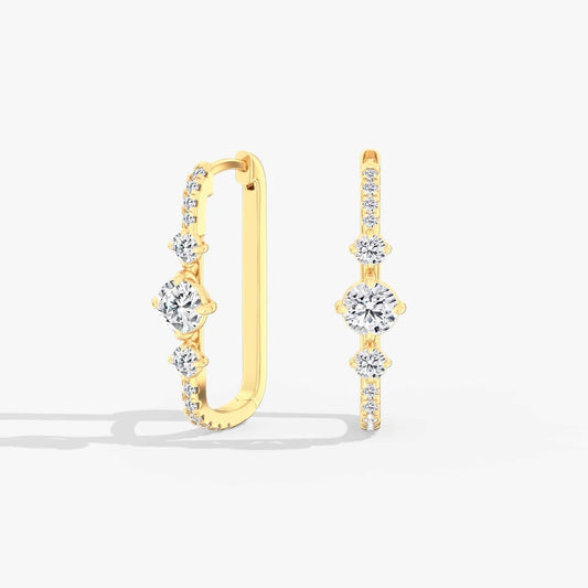 Medium yellow gold hoop diamond earrings.