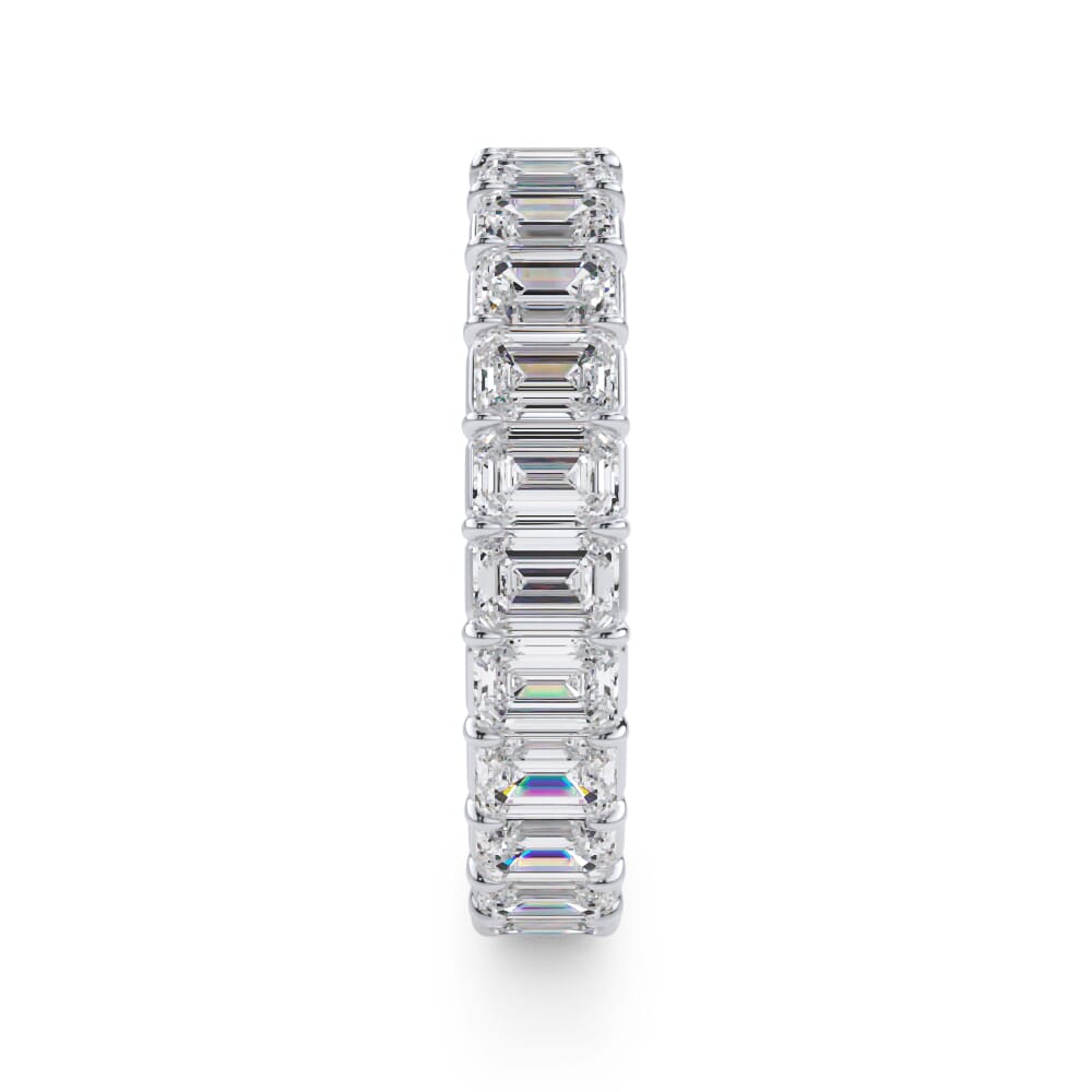 Emerald diamond eternity band in white gold.
