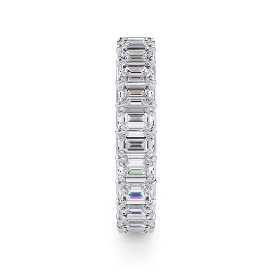 Emerald diamond eternity band in white gold.