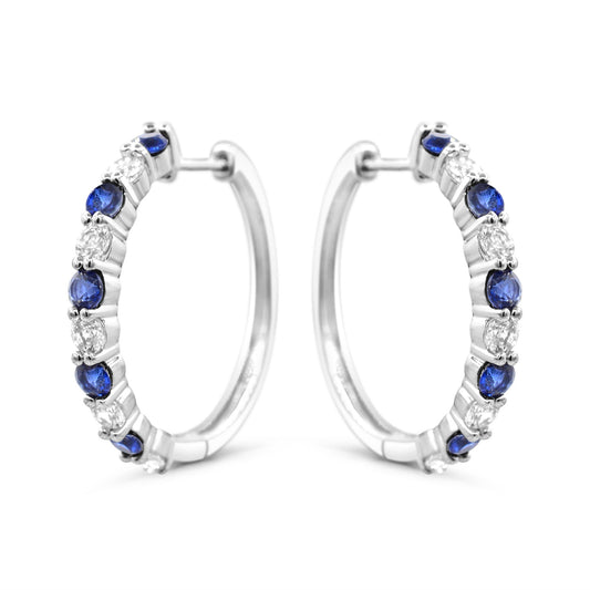 Sterling silver hoops with blue sapphires.