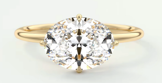 Oval diamond solitaire ring, yellow gold band.