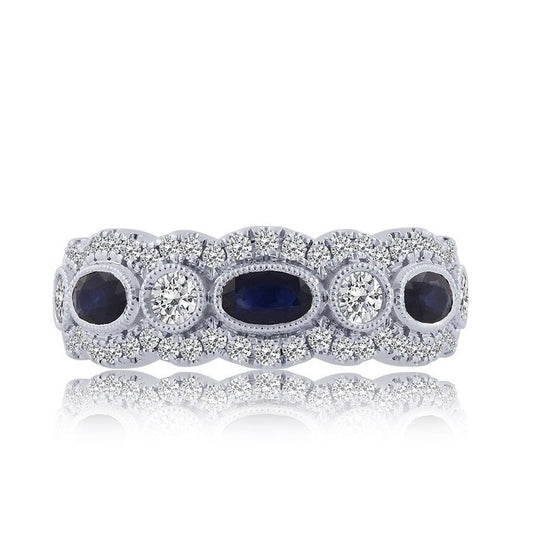 Oval sapphire ring with diamond halo.