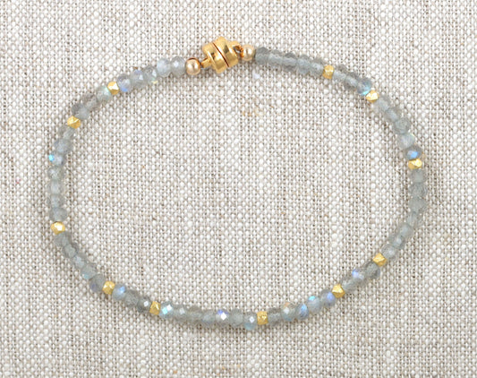 Labradorite bead bracelet with gold accents.
