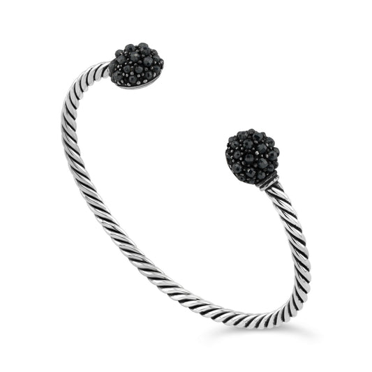 Sterling silver bangle with hematite ends.