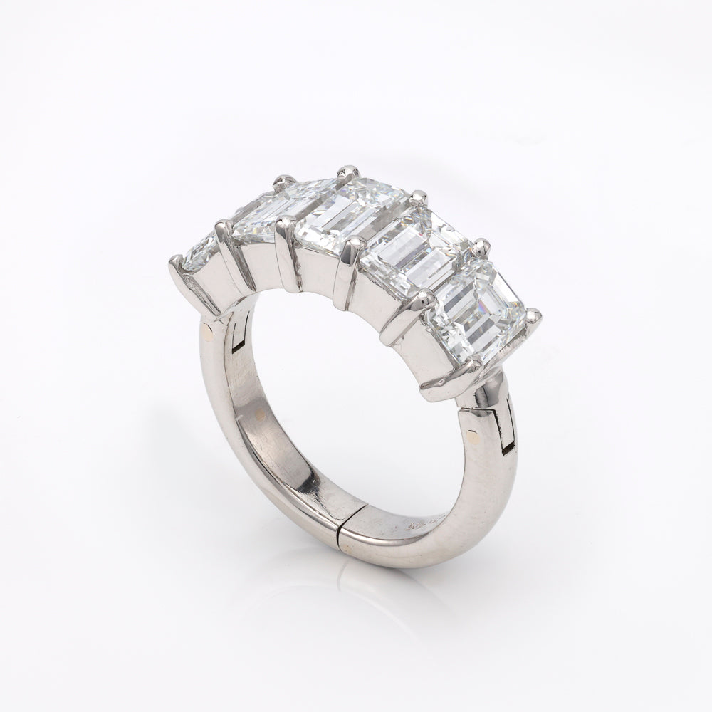 Silver ring with rectangular clear gemstones.