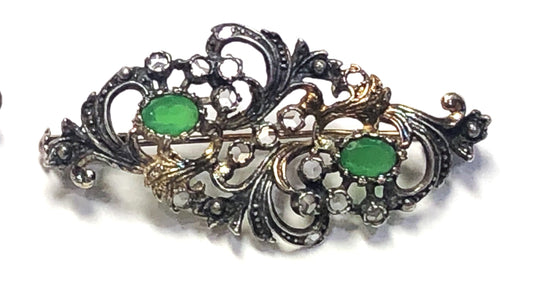 Georgian filigree pin with green stones.