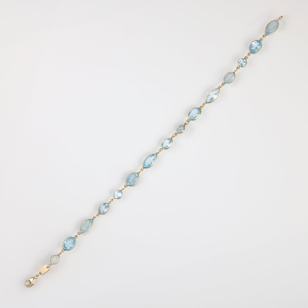 Fancy link bracelet with blue topazes.
