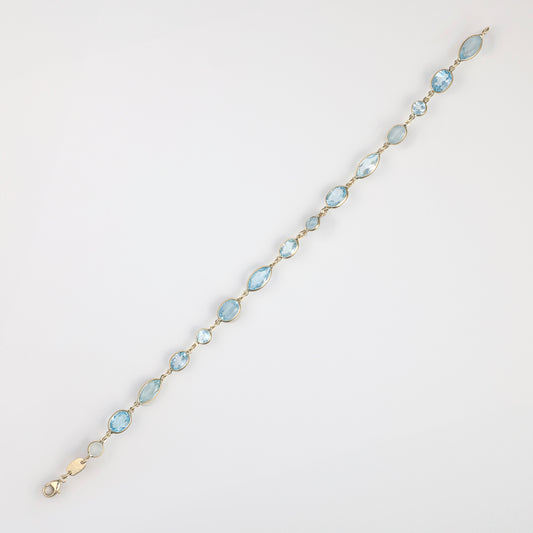 Fancy link bracelet with blue topazes.