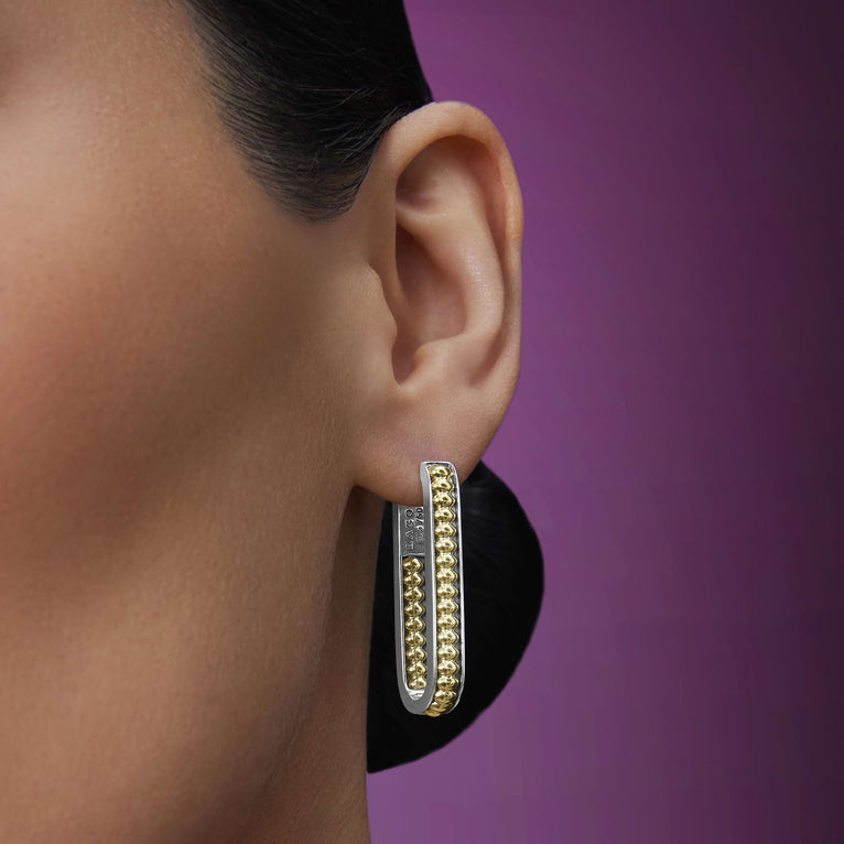 Sterling silver oval hoop earrings, beaded design.