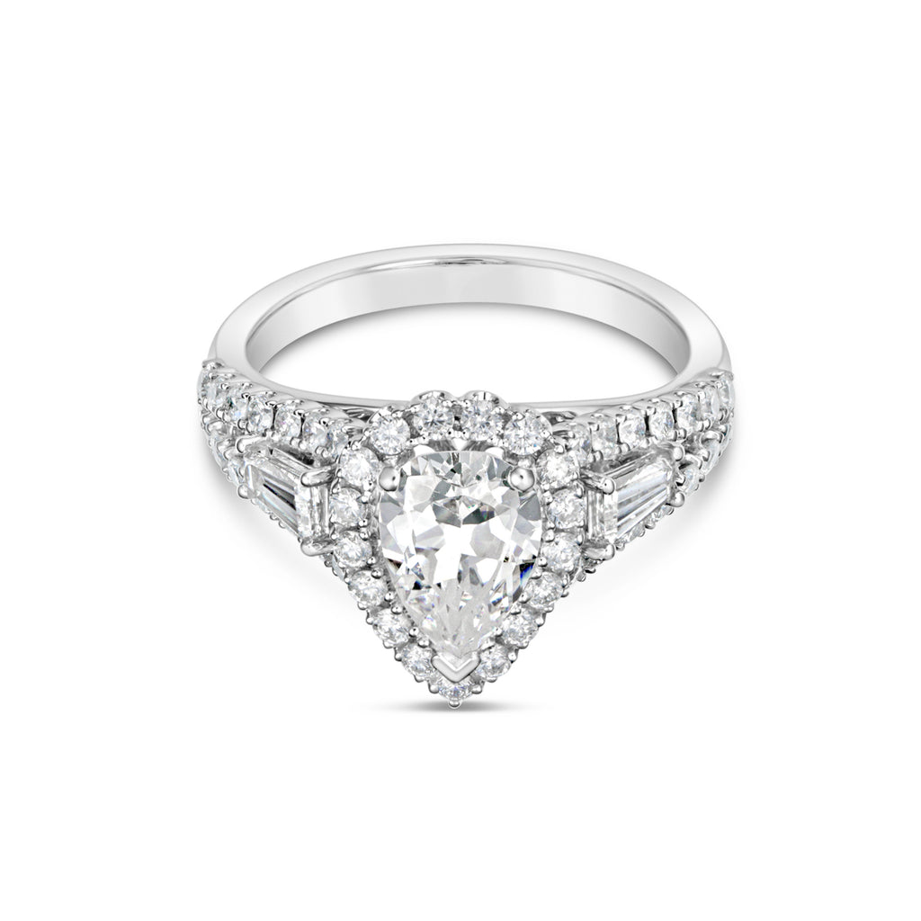 Halo diamond ring with baguette accents.