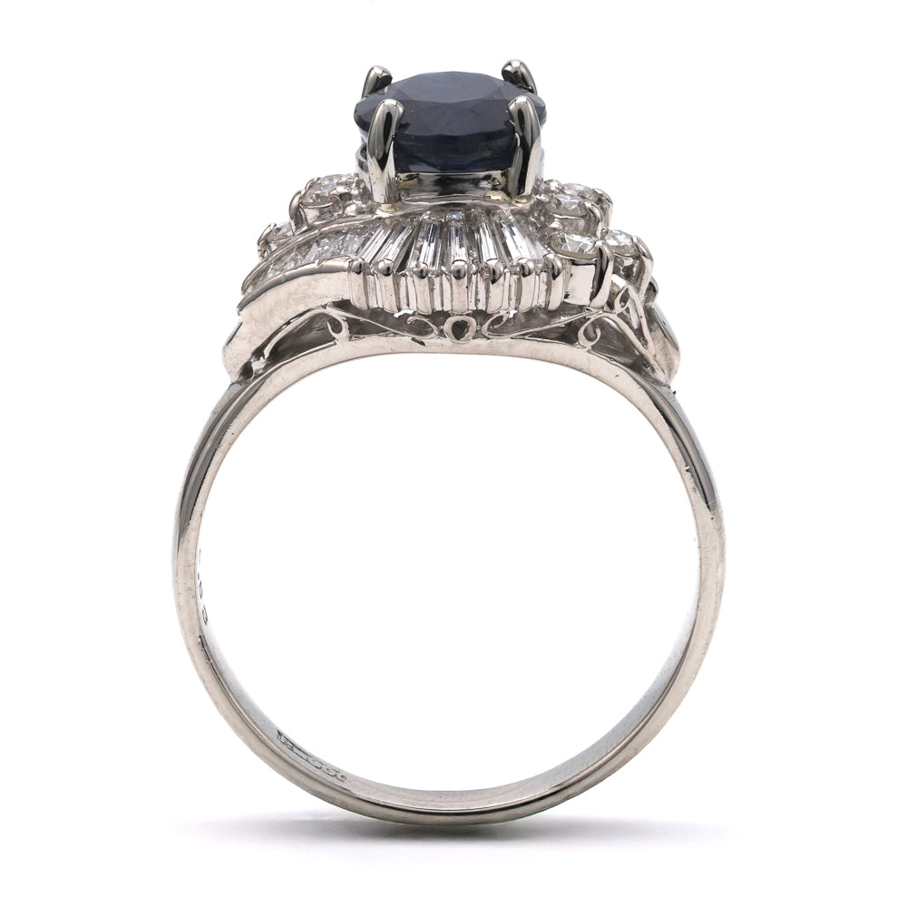 Platinum ring with sapphire and diamonds.