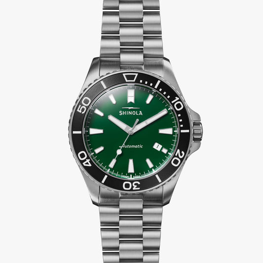 Green dial stainless steel dive watch.