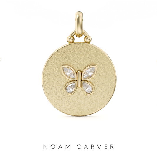 Yellow gold pendant with diamond butterfly design.