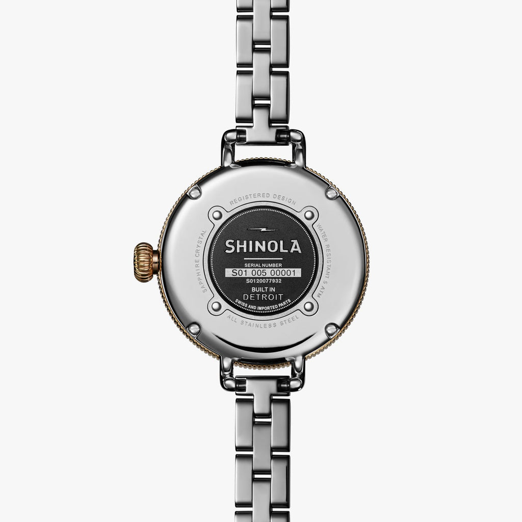 Stainless steel watch back with logo.