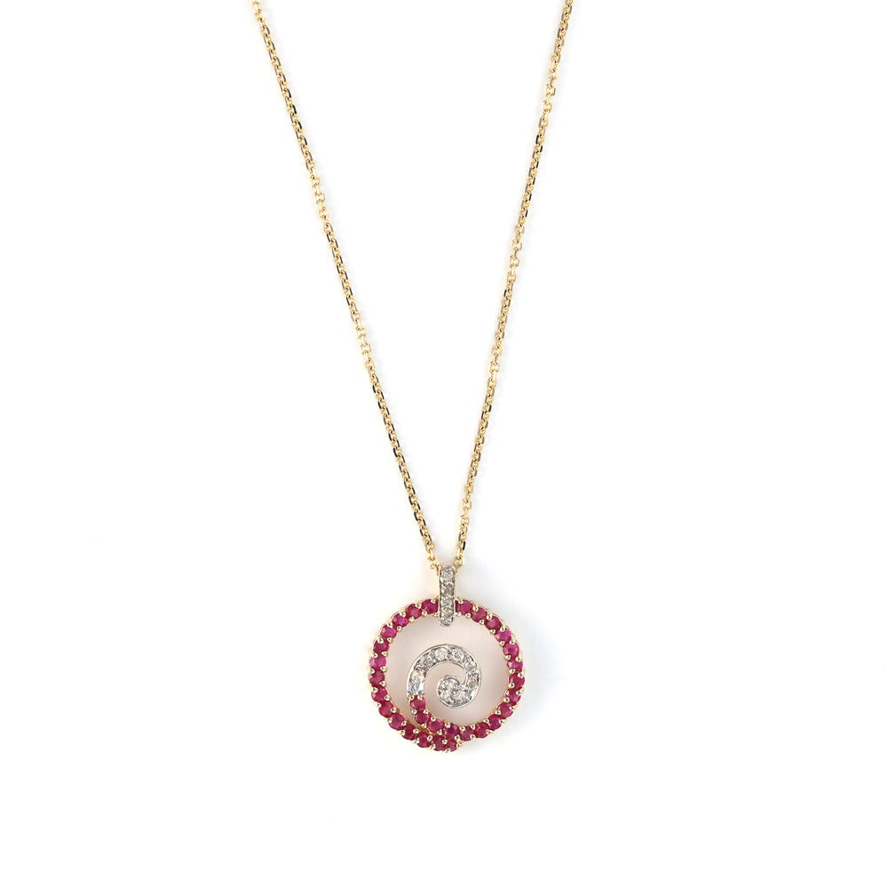 Ruby and diamond swirl medallion necklace.