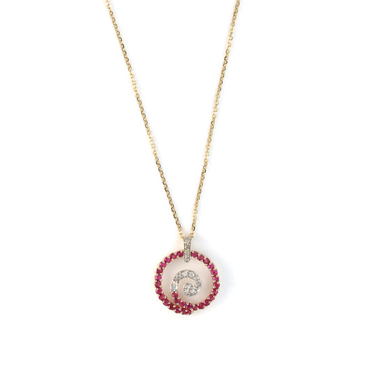 Ruby and diamond swirl medallion necklace.
