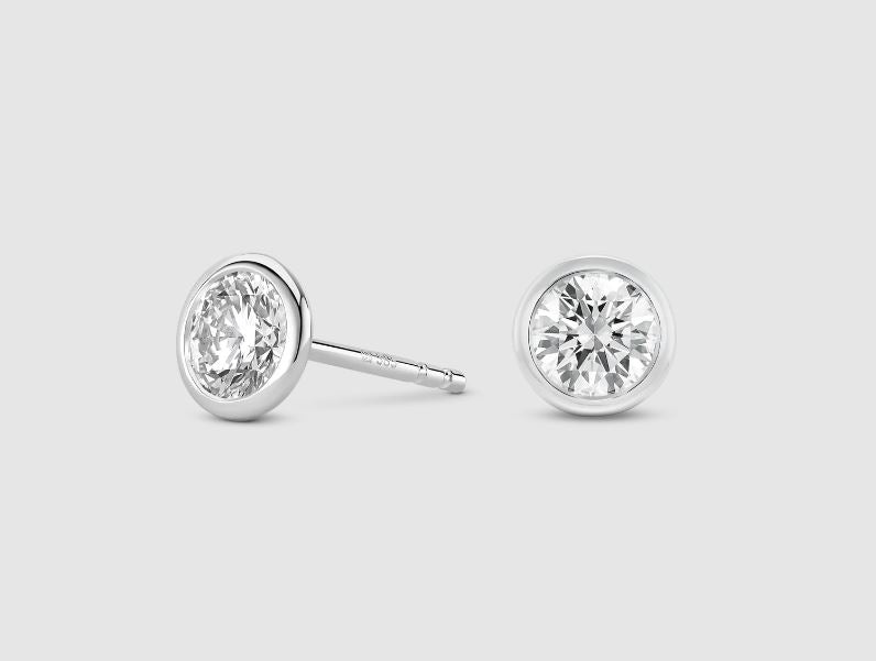 14K white gold diamond stud earrings.