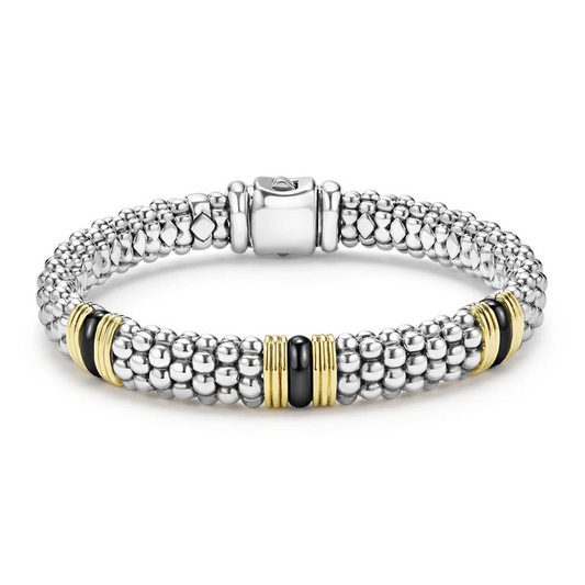 Sterling silver bracelet with gold accents.