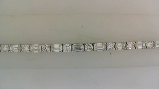 Round and baguette diamonds, white gold bracelet.