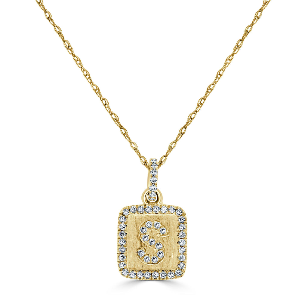 Yellow gold necklace with diamond initial pendant.