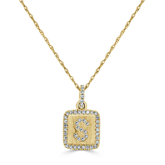Yellow gold necklace with diamond initial pendant.