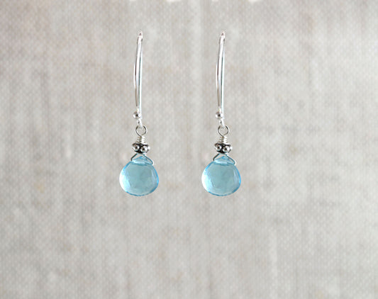 Sterling silver earrings with blue quartz teardrops.