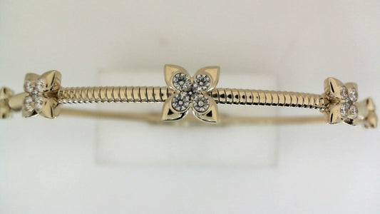 Yellow gold bracelet with diamond floral accents.