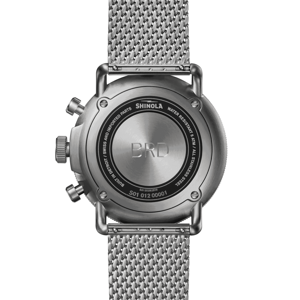 Stainless steel watch back with mesh band.