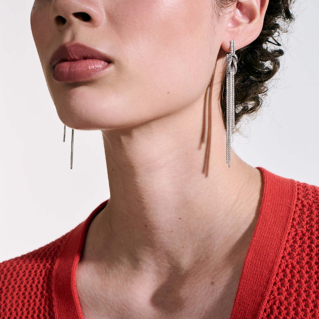 Sterling silver dangle earrings, polished finish.