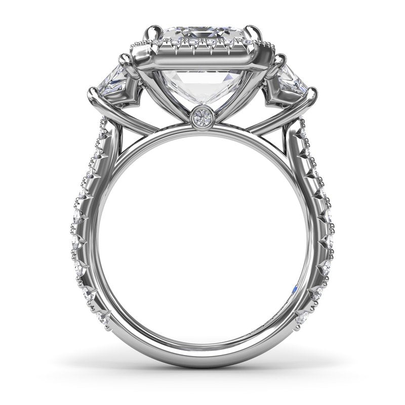 Three-stone diamond ring, white gold, halo design.