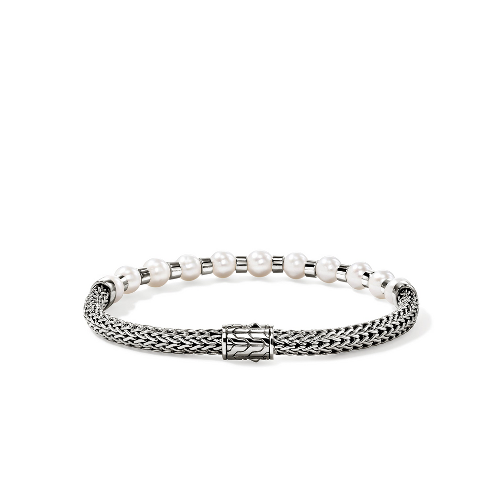 Sterling silver bracelet with pearls and clasp.