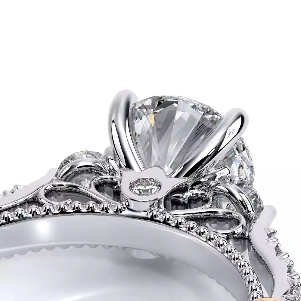 White gold ring with intricate diamond setting.