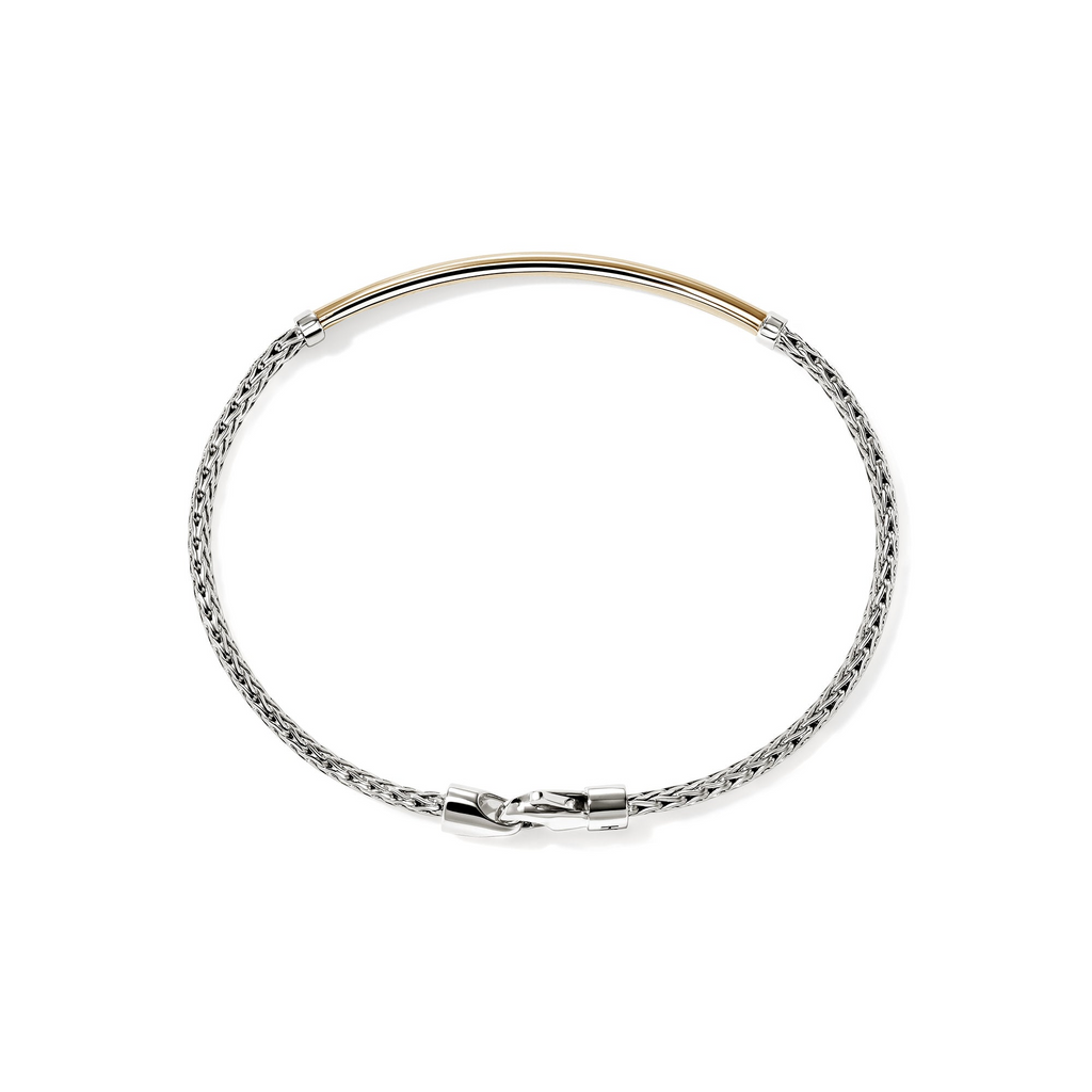 Sterling silver bracelet with yellow gold accent.