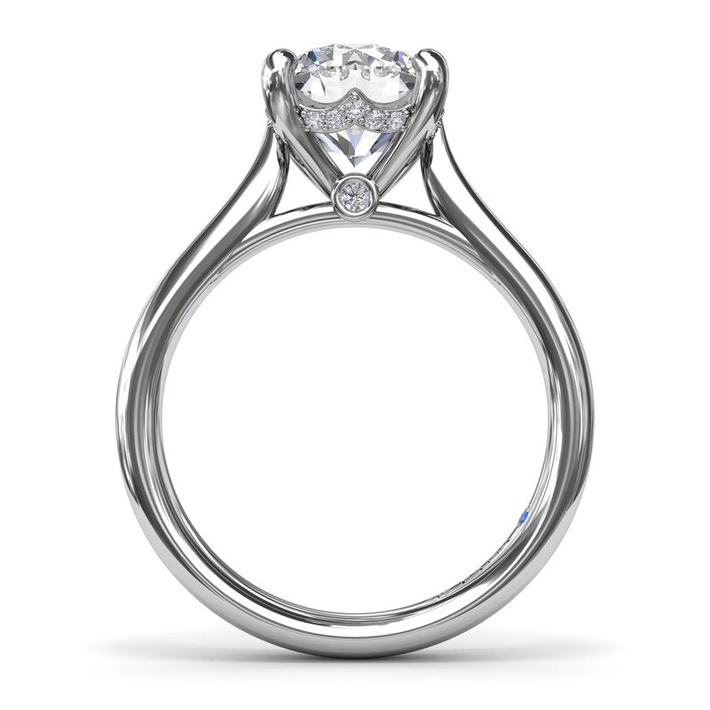 14K white gold solitaire ring with accents.