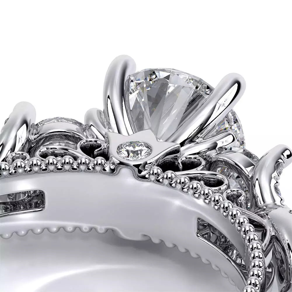 White gold ring with intricate diamond setting.