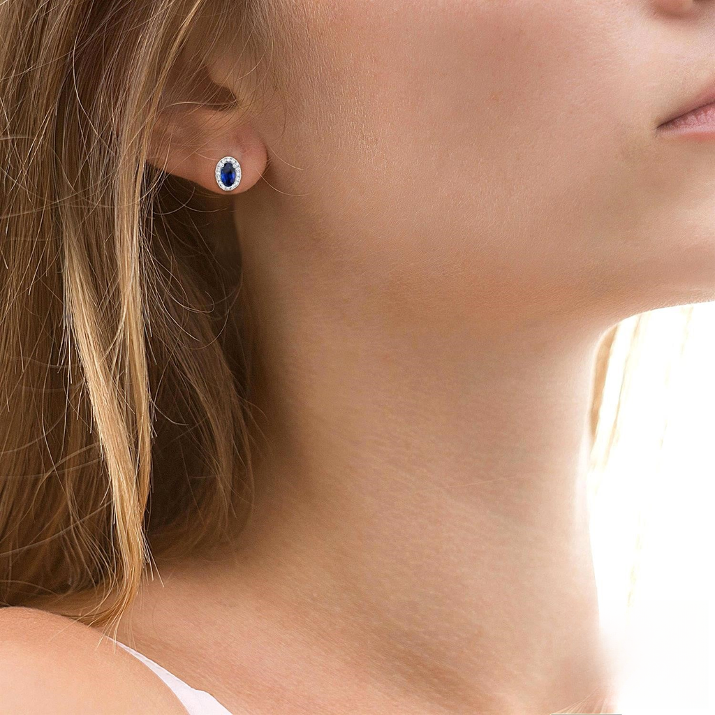Oval sapphire stud earrings in white gold.