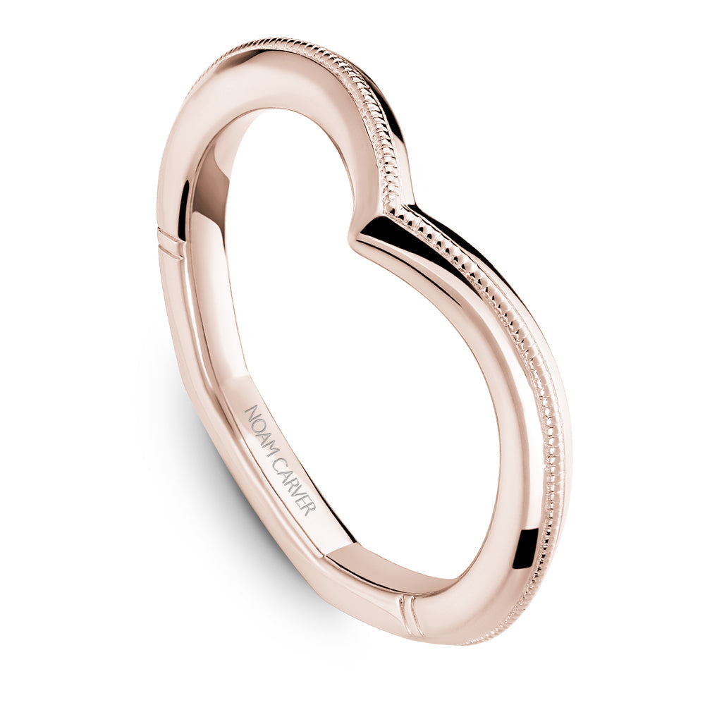 Rose gold engagement ring with milgrain detail.