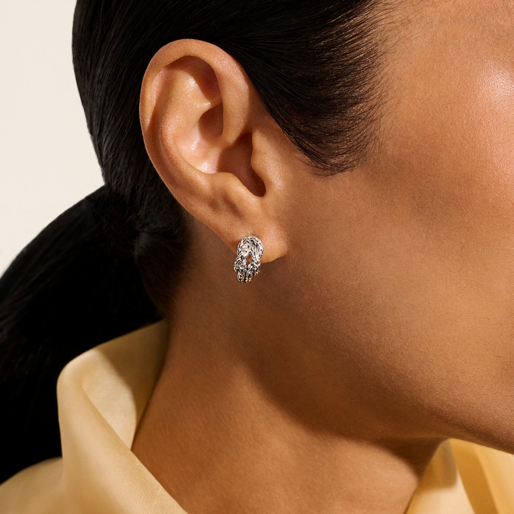 Sterling silver polished J hoop earrings.